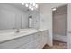 Double sink vanity with framed mirror in bright bathroom at 3741 Tea Olive Rd, Gastonia, NC 28056