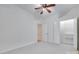 Bedroom with neutral walls, ceiling fan and carpet; also includes a walk-in closet at 3741 Tea Olive Rd, Gastonia, NC 28056