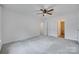 Spacious carpeted bedroom with doors leading to the hall and bathroom at 3741 Tea Olive Rd, Gastonia, NC 28056
