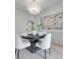 Elegant dining room with a modern chandelier, wainscotting, and neutral decor at 3741 Tea Olive Rd, Gastonia, NC 28056