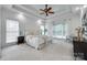 Spacious main bedroom with a tray ceiling, plush carpet, and a wall of bright windows at 3741 Tea Olive Rd, Gastonia, NC 28056