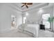 Bright main bedroom featuring a tray ceiling, neutral decor, and an ensuite bathroom at 3741 Tea Olive Rd, Gastonia, NC 28056