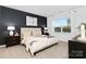 Comfortable bedroom with a large window, modern accents, and plush bedding at 3940 Ashton Nw Dr, Conover, NC 28613