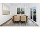 Inviting dining room with a wooden table, six chairs, a large window, and contemporary decor at 3940 Ashton Nw Dr, Conover, NC 28613