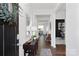 Bright and open hallway with hardwood floors leading to a dining area and home office at 3940 Ashton Nw Dr, Conover, NC 28613