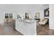 Bright open-concept kitchen with stainless steel appliances, granite countertops, and dining area at 3940 Ashton Nw Dr, Conover, NC 28613