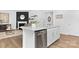 A kitchen island features white cabinets, a stainless steel dishwasher, and a granite countertop at 3940 Ashton Nw Dr, Conover, NC 28613