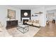 Modern living room with a fireplace, hardwood floors, neutral furniture, and plenty of natural light at 3940 Ashton Nw Dr, Conover, NC 28613