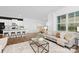Open-concept living room with bright windows, hardwood flooring, and eat-in kitchen at 3940 Ashton Nw Dr, Conover, NC 28613
