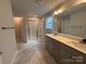 Bright bathroom featuring a double sink vanity and a walk-in shower with subway tile at 4029 Port Richmond Ave # 6, Gastonia, NC 28056