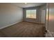 Cozy bedroom features plush carpeting and a large window with a view at 4029 Port Richmond Ave # 6, Gastonia, NC 28056