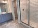 Bathroom featuring double vanities, subway-tiled shower, modern fixtures and marble flooring at 4037 Port Richmond Ave # 8, Gastonia, NC 28056