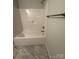 Bathroom featuring a shower and bathtub combo with shower head, neutral walls and modern fixtures at 4037 Port Richmond Ave # 8, Gastonia, NC 28056