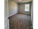 Bedroom with carpeted floors, a window providing natural light, and white base trim at 4037 Port Richmond Ave # 8, Gastonia, NC 28056