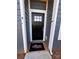 Charming front door with glass pane and Adams Homes welcome mat, enhancing curb appeal at 4037 Port Richmond Ave # 8, Gastonia, NC 28056