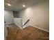 Carpeted hallway provides access to other areas of the home, offering a cozy feel at 4037 Port Richmond Ave # 8, Gastonia, NC 28056
