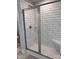 Bathroom with tiled shower with glass door, shower head, a shower seat, neutral walls and marble flooring at 4037 Port Richmond Ave # 8, Gastonia, NC 28056