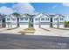 New townhomes with attached garages, manicured lawns, and coordinated exterior design at 4037 Port Richmond Ave # 8, Gastonia, NC 28056
