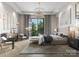 Bright main bedroom featuring a large window, stylish furnishings, and modern decor at 409 Queens Rd # 202, Charlotte, NC 28207