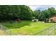 Spacious fenced backyard with a playset, trampoline, and storage shed at 4916 Leepers Creek Rd, Maiden, NC 28650