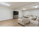 Finished basement with a comfy sectional sofa and a large television for entertainment at 4916 Leepers Creek Rd, Maiden, NC 28650