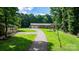 Ranch home with a long driveway, two car garage, and well maintained lawn at 4916 Leepers Creek Rd, Maiden, NC 28650