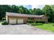 Charming brick home with a well-manicured front yard, complemented by a two-car garage and inviting walkway at 4916 Leepers Creek Rd, Maiden, NC 28650