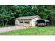Detached garage with two bays, an adjacent carport, and ample green space at 4916 Leepers Creek Rd, Maiden, NC 28650