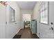 Hallway featuring a bathroom at the end of the hallway and a door to the exterior at 4916 Leepers Creek Rd, Maiden, NC 28650