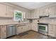 Functional kitchen with stainless steel appliances, tile backsplash, and lots of natural light at 4916 Leepers Creek Rd, Maiden, NC 28650
