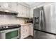 Bright kitchen featuring stainless steel appliances, ample counter space and plenty of storage at 4916 Leepers Creek Rd, Maiden, NC 28650
