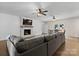Open concept living room features a fireplace, ceiling fans, and access to the backyard at 4916 Leepers Creek Rd, Maiden, NC 28650