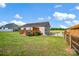 Backyard view featuring a wooden deck, fenced yard, and lush green grass at 509 Brawley Rd # 7, Cleveland, NC 27013