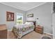 Cozy bedroom featuring natural light, a comfortable bed with a decorative quilt and wood furnishings at 509 Brawley Rd # 7, Cleveland, NC 27013