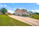Side exterior view of home with a long driveway, landscaped front porch, and spacious yard at 509 Brawley Rd # 7, Cleveland, NC 27013