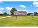 Charming single-story home featuring a sprawling green lawn and a welcoming front porch with red shutters at 509 Brawley Rd # 7, Cleveland, NC 27013