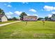 Inviting single-story home with a spacious front yard, long driveway, and additional outbuildings at 509 Brawley Rd # 7, Cleveland, NC 27013