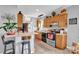 Efficient kitchen layout with wood cabinets, stainless appliances, and breakfast bar seating at 509 Brawley Rd # 7, Cleveland, NC 27013
