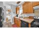 Well-appointed kitchen featuring wood cabinets, modern appliances, and convenient laundry access at 509 Brawley Rd # 7, Cleveland, NC 27013
