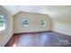 Bright and airy bedroom with hardwood floors, white walls, and two windows at 5604 Nc 152 E Hwy, Rockwell, NC 28138