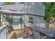 Relaxing back deck with outdoor dining area, perfect for entertaining guests at 5995 Tall Tree Ln, Harrisburg, NC 28075