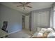 Bedroom featuring closet, hardwood flooring, and a bright window, providing an appealing living space at 5995 Tall Tree Ln, Harrisburg, NC 28075