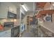 Modern kitchen with stainless steel appliances, granite countertops, and ample pantry space at 5995 Tall Tree Ln, Harrisburg, NC 28075