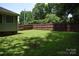 Spacious backyard with a well-maintained lawn and a tall, brown, privacy fence at 605 Beavers Cove Nw Ln # 15, Concord, NC 28027