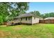 View of the home's backyard featuring a wooden deck and partial fencing at 605 Beavers Cove Nw Ln # 15, Concord, NC 28027