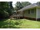 A wooden deck extends from the rear of the home providing an outdoor space to relax at 605 Beavers Cove Nw Ln # 15, Concord, NC 28027