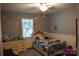 Bedroom features a ceiling fan and cute decorations at 605 Beavers Cove Nw Ln # 15, Concord, NC 28027