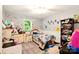 Bedroom features a light-filled window and a comfortable bed with stuffed animals at 605 Beavers Cove Nw Ln # 15, Concord, NC 28027