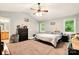 Spacious bedroom featuring a ceiling fan, carpeted floor, and lots of natural light at 605 Beavers Cove Nw Ln # 15, Concord, NC 28027