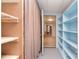 Basement with white shelves, and open doorway leading to a kitchen area at 6227 Dogwood Ln, Waxhaw, NC 28173